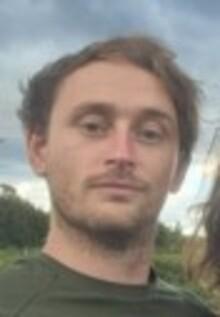 Steve Beddows, a white man with short brown hair, wearing a dark t-shirt, looking at the camera