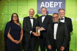 2024 ADEPT Awards - image of people holding an award, dressed for a black tie dinner