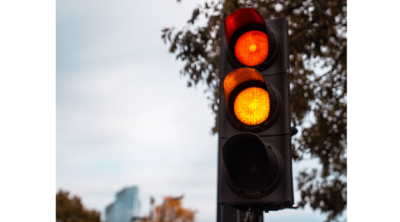 close up of traffic lights red and amber lit